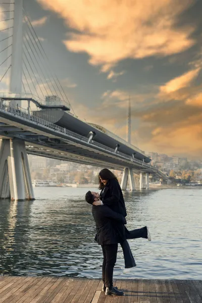 Romantic Couple Silhouette Under Bosphorus Bridge at Sunset