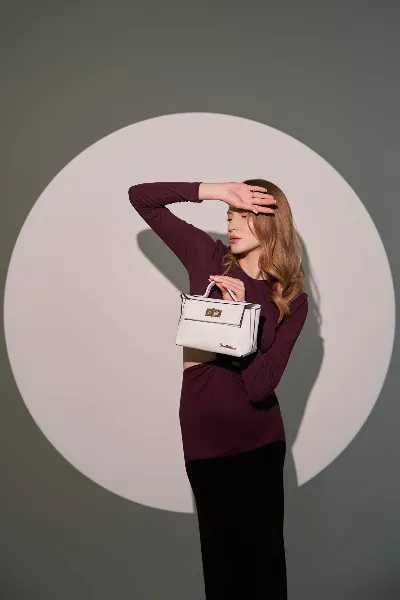Spotlight Circle Studio Portrait of Model with White Handbag